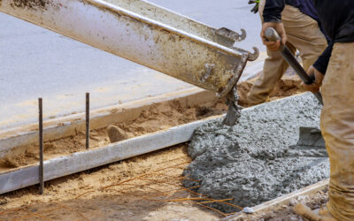 Construction of a concrete walkway around a residential rural house in manual of the pavement with a special tool
